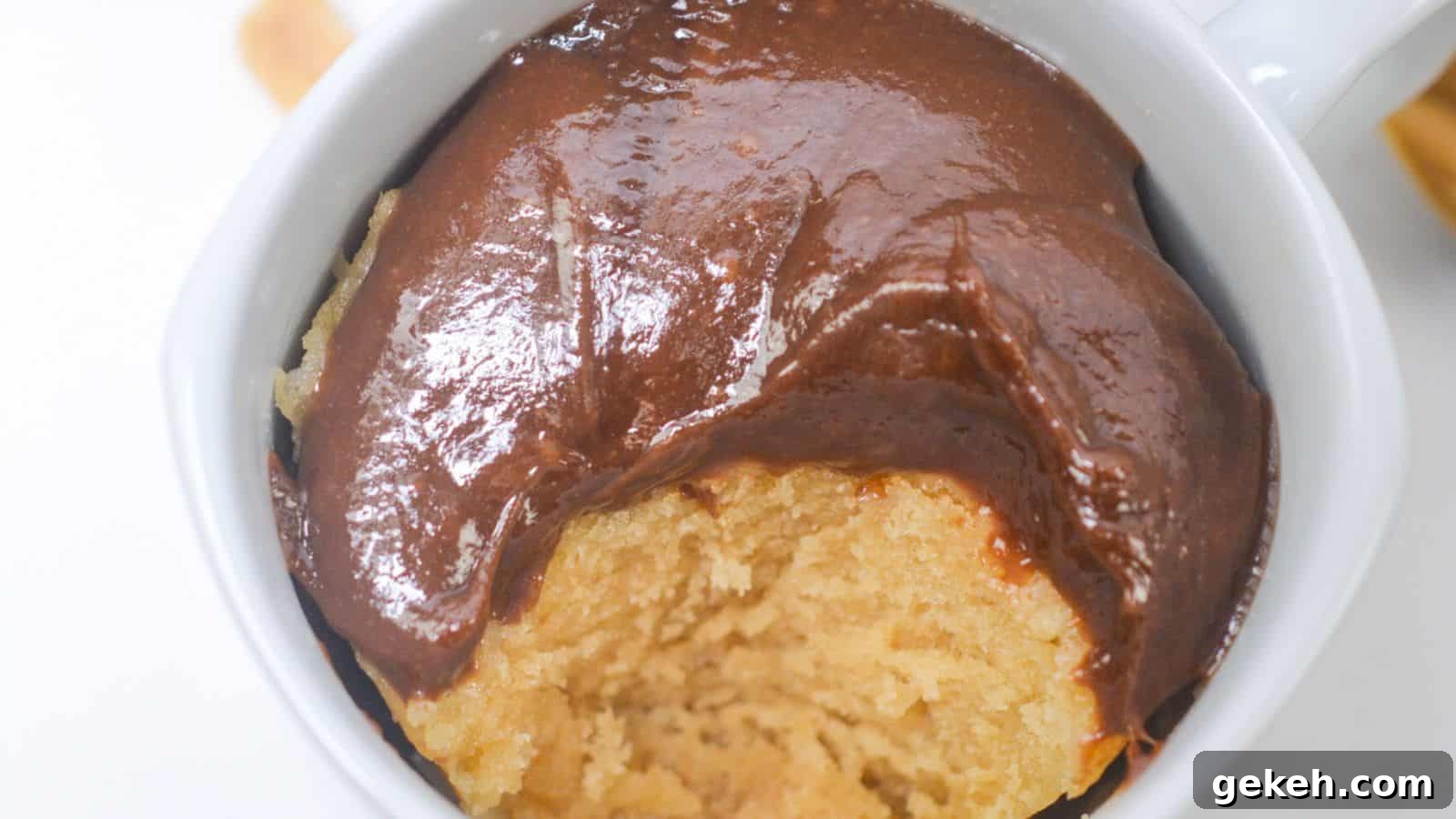 19 Desserts for Two to Share Straight from the Pan 16 A peanut butter mug cake topped with glossy chocolate sauce.
