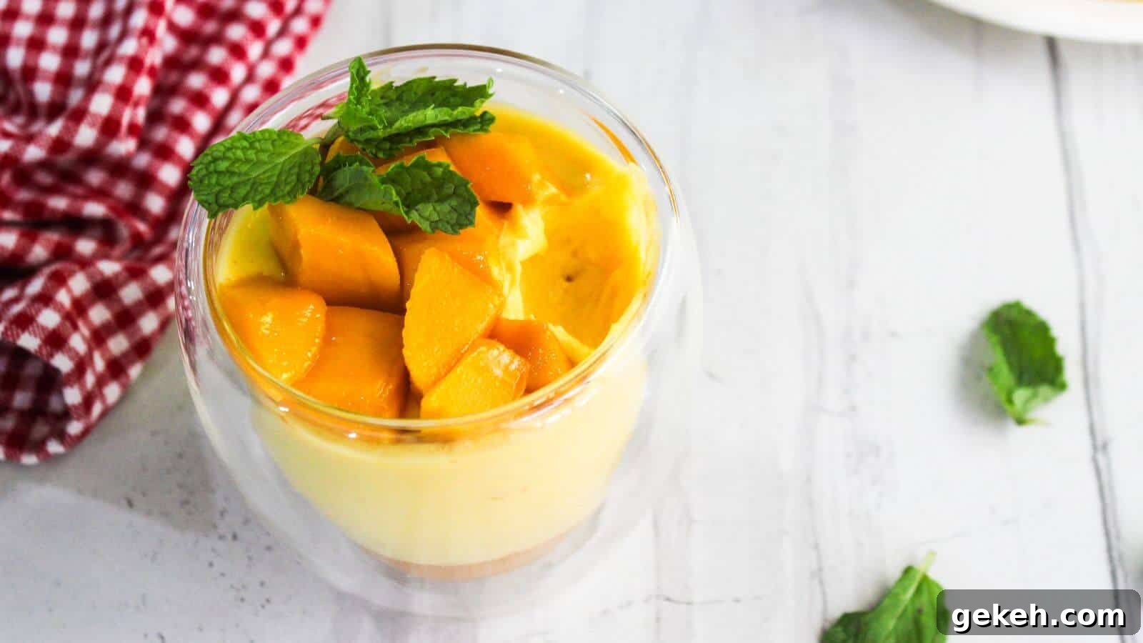 19 Desserts for Two to Share Straight from the Pan 8 A glass cup of mango mousse topped with mango cubes and mint.