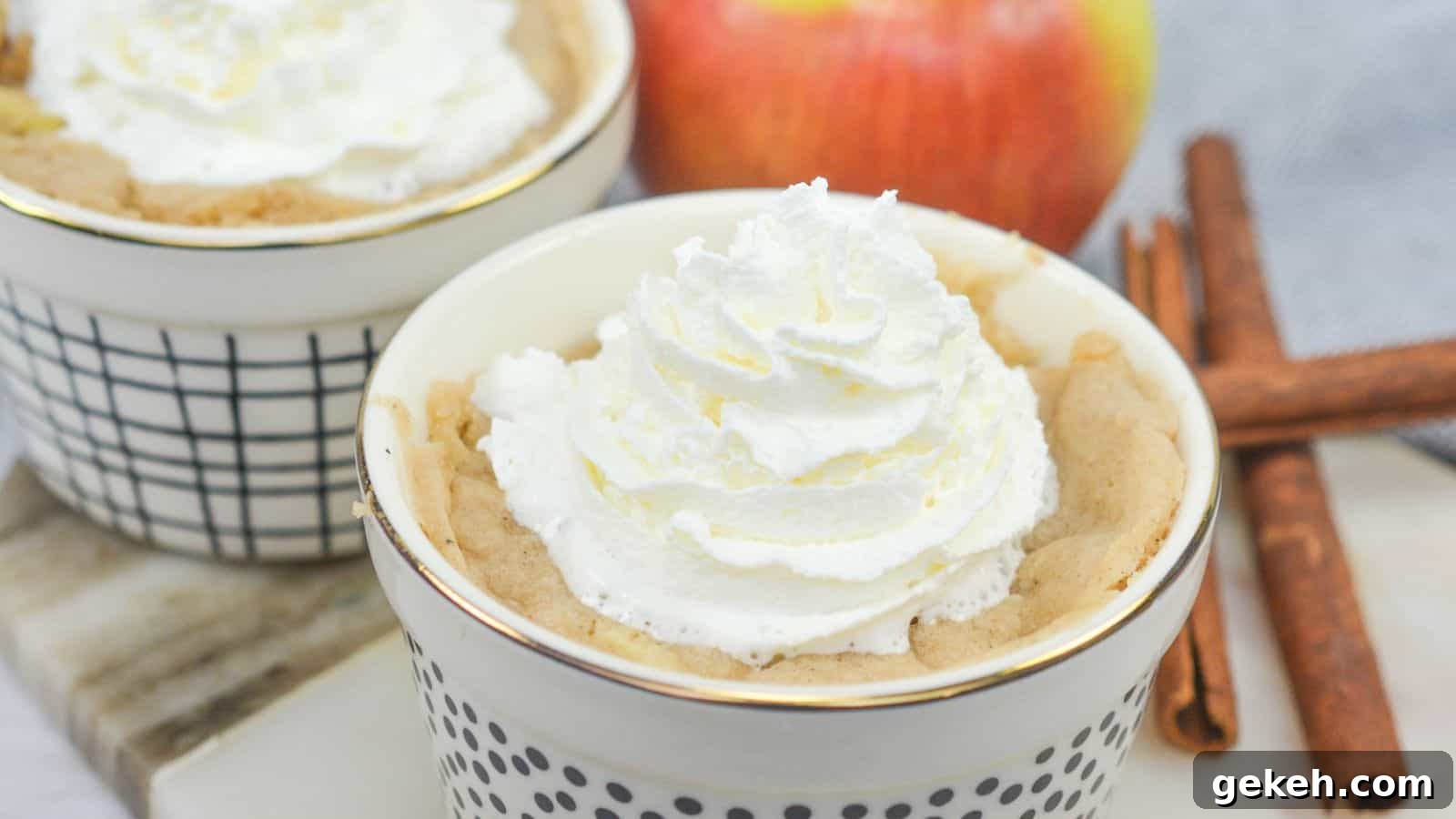 19 Desserts for Two to Share Straight from the Pan 9 Apple mug cakes in ramekins with cinnamon sticks.