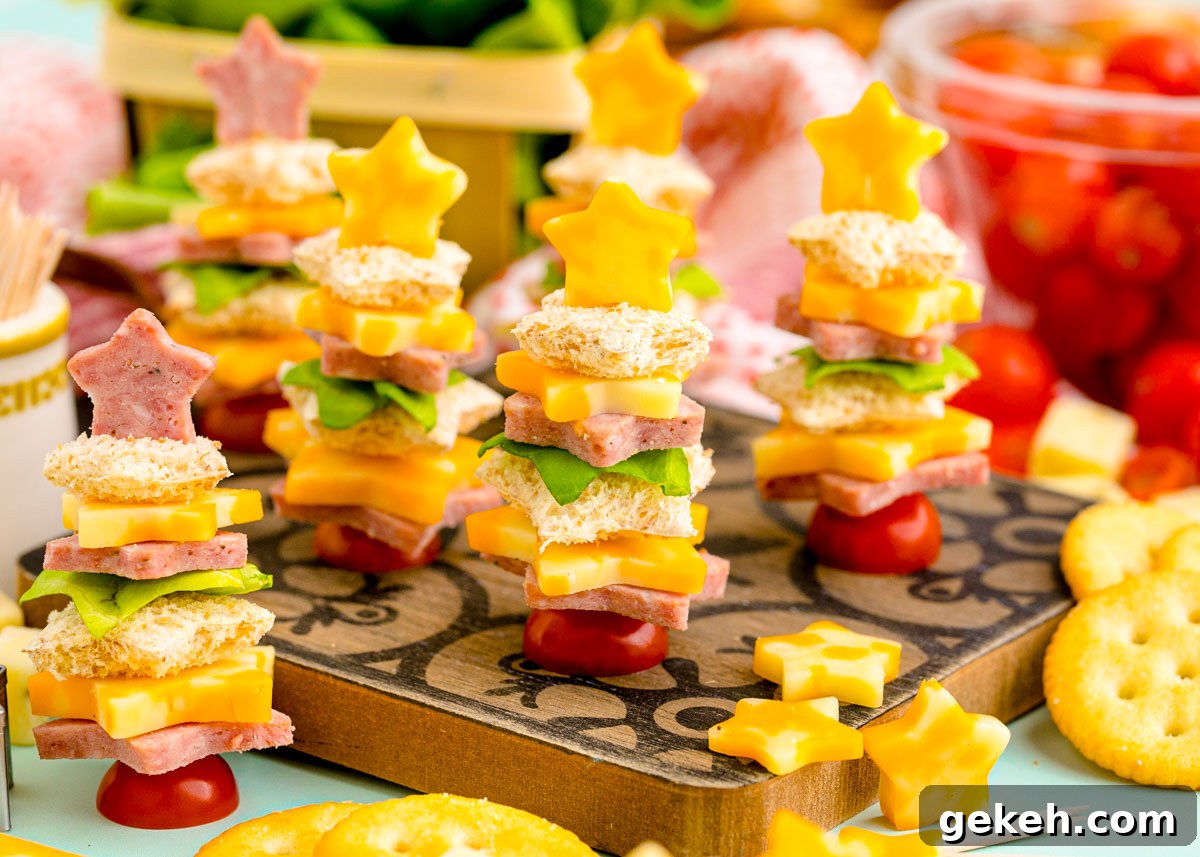 Festive Christmas Appetizer Ideas for Holiday Entertaining 6 Easy Christmas tree shaped appetizers on a wooden cutting board ready to be served.