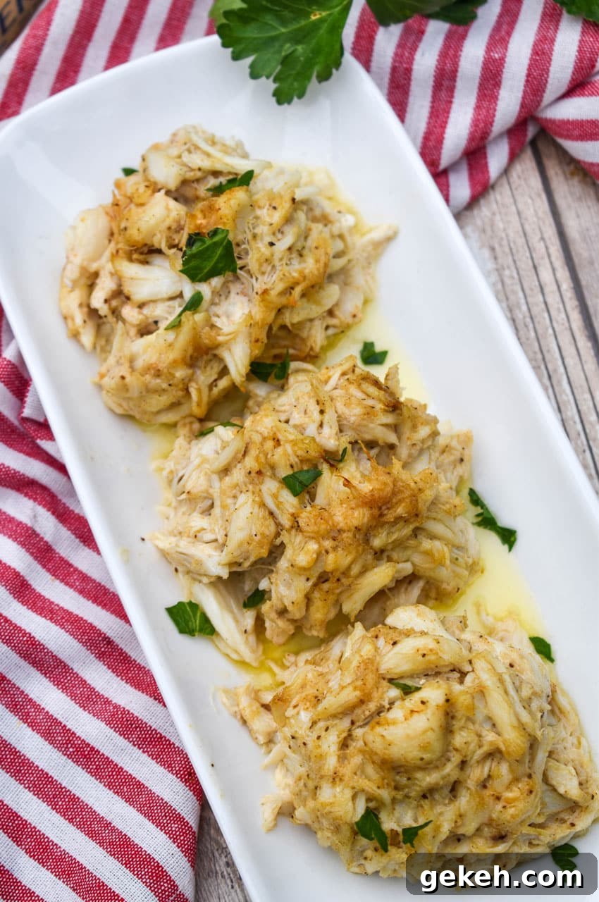 Jerry’s Place Baked Lump Crab Cakes Recipe (Copycat) 2 three crab bombs arranged in a row on a narrow white serving plate