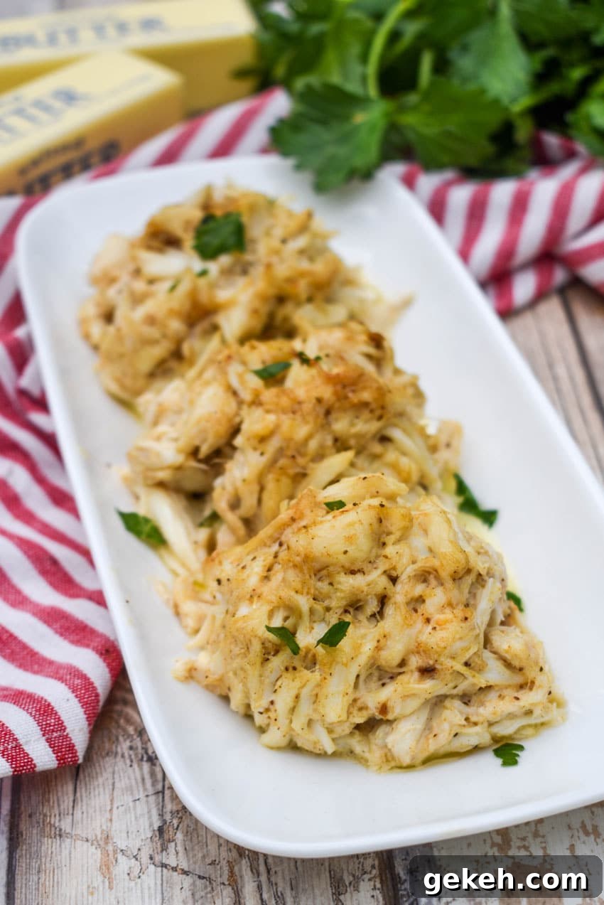 Jerry’s Place Baked Lump Crab Cakes Recipe (Copycat) 7 three crab bombs arranged in a row on a narrow white serving plate