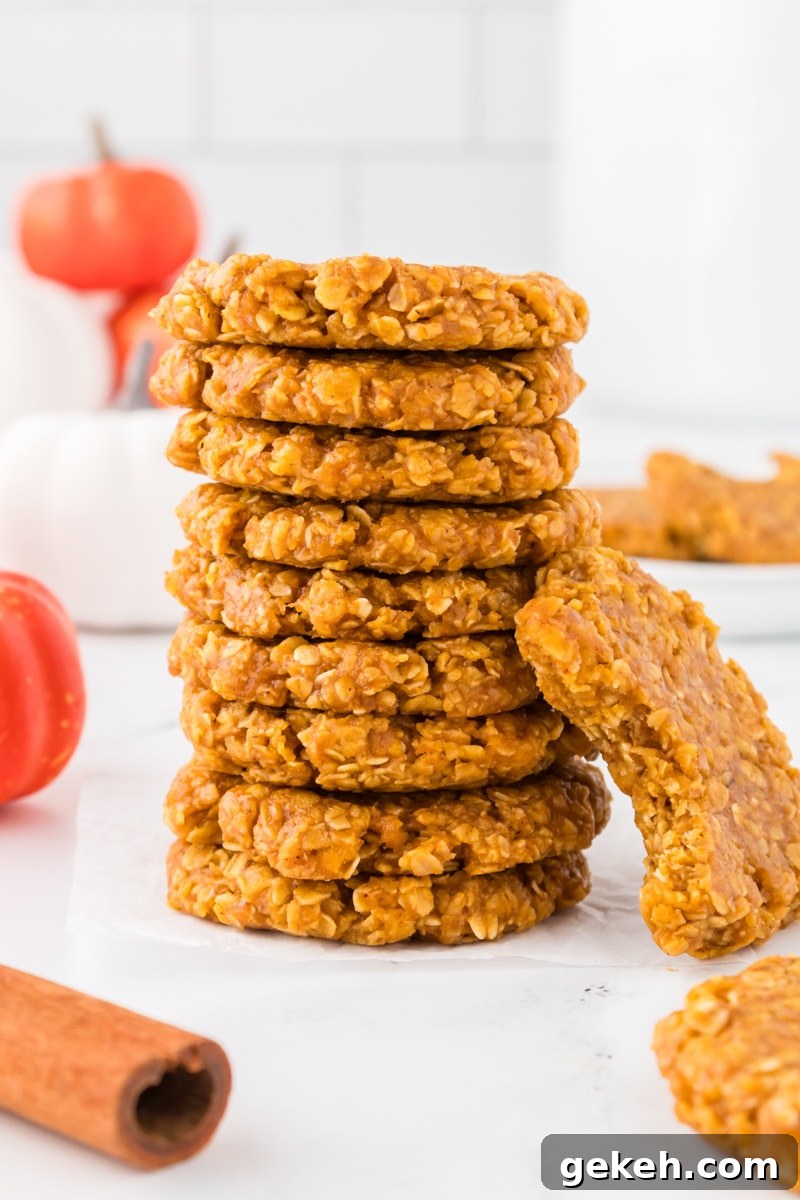 No-Bake Pumpkin Oat Cookies: Quick Fall Treats 2 A stack of pumpkin no bake cookies, one with a bite taken out of it,.