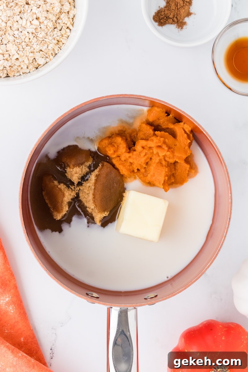 No-Bake Pumpkin Oat Cookies: Quick Fall Treats 4 A saucepan with milk, brown sugar, pumpkin, and butter inside.