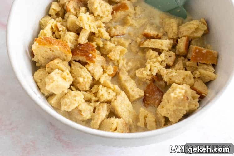 cubes of challah in bowl with liquid