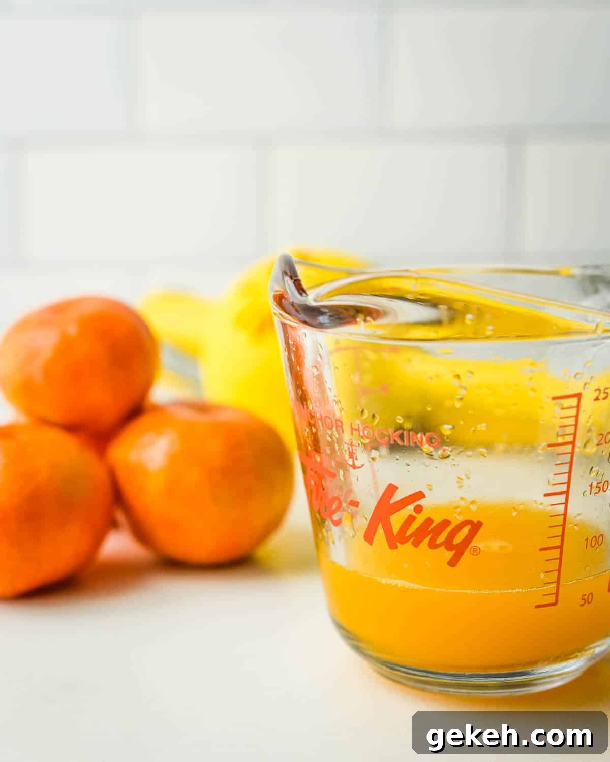The juice from the citrus after squeezing.