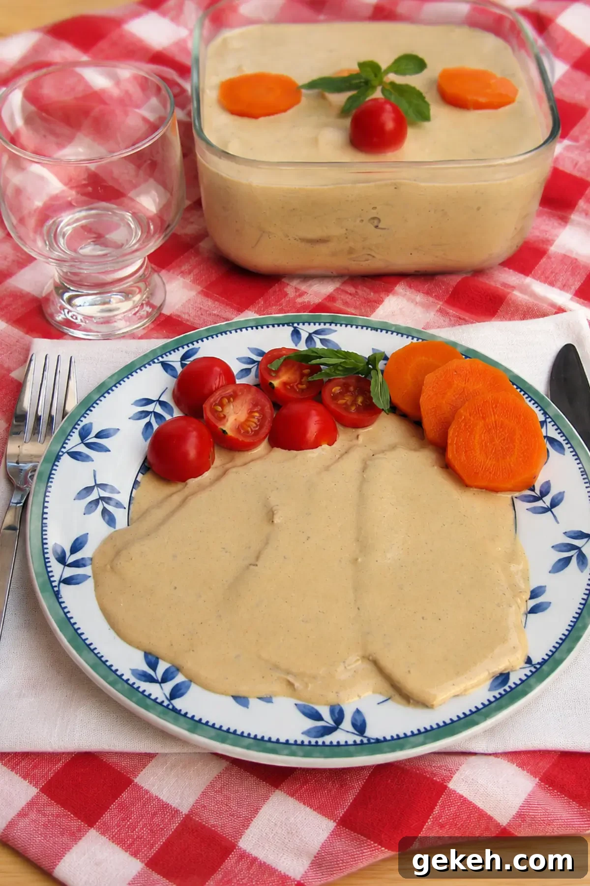 Vitello Tonnato: Classic Italian Cold Veal with Tuna-Caper Sauce 4 Plate of Vitello Tonnato covered with creamy tuna sauce and served with cherry tomatoes, basil, and carrot slices.