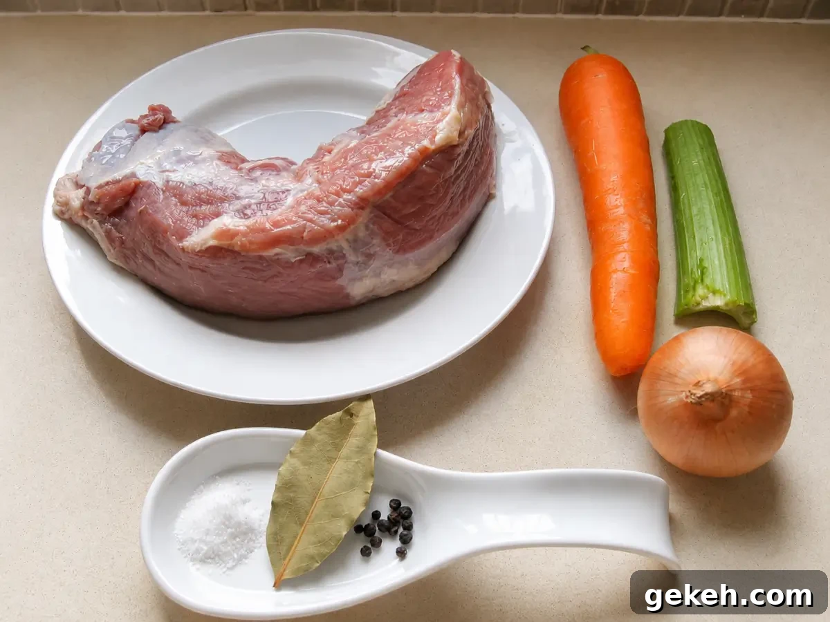 Vitello Tonnato: Classic Italian Cold Veal with Tuna-Caper Sauce 5 Veal girello with carrot, celery, onion, bay leaf, salt, and pepper corns prepared for Vitello Tonnato.