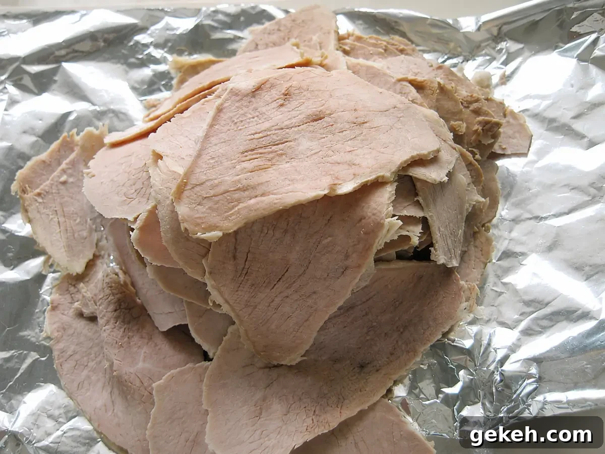 Vitello Tonnato: Classic Italian Cold Veal with Tuna-Caper Sauce 7 Thin slices of cooked veal prepared for assembling Vitello Tonnato.