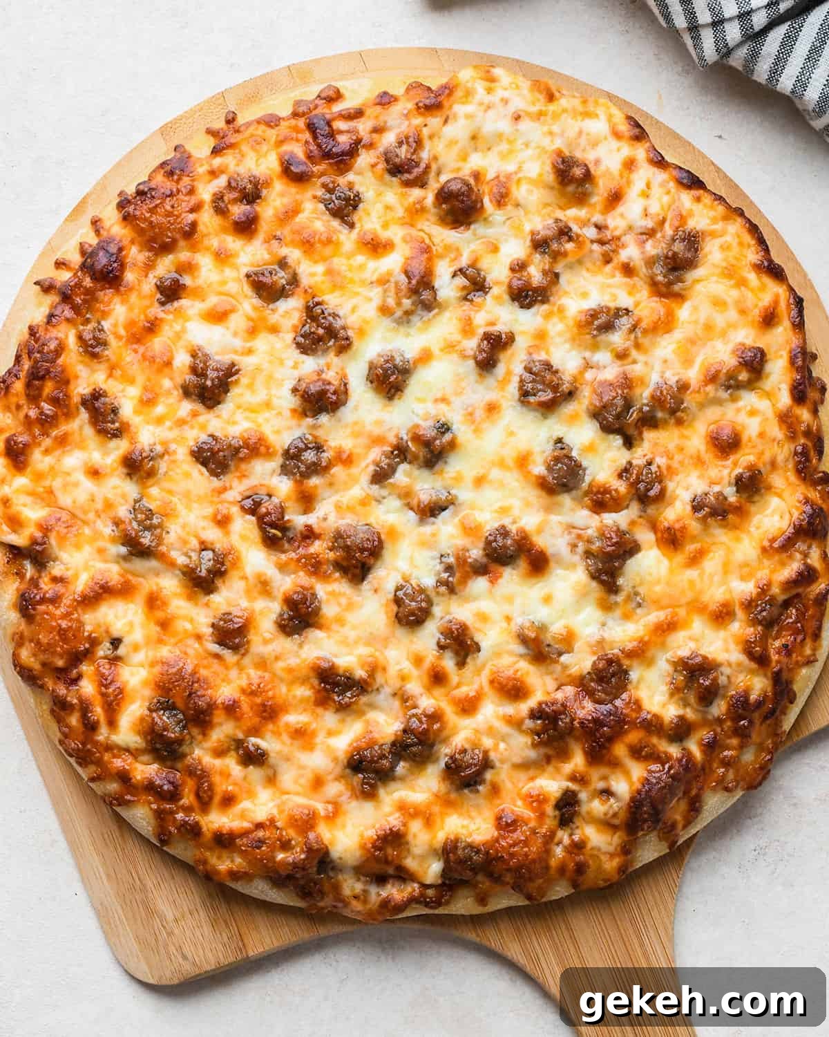 Classic Sausage Pizza Recipe: Crispy Crust & Savory Toppings 13 Sausage Pizza after baking on a pizza peel