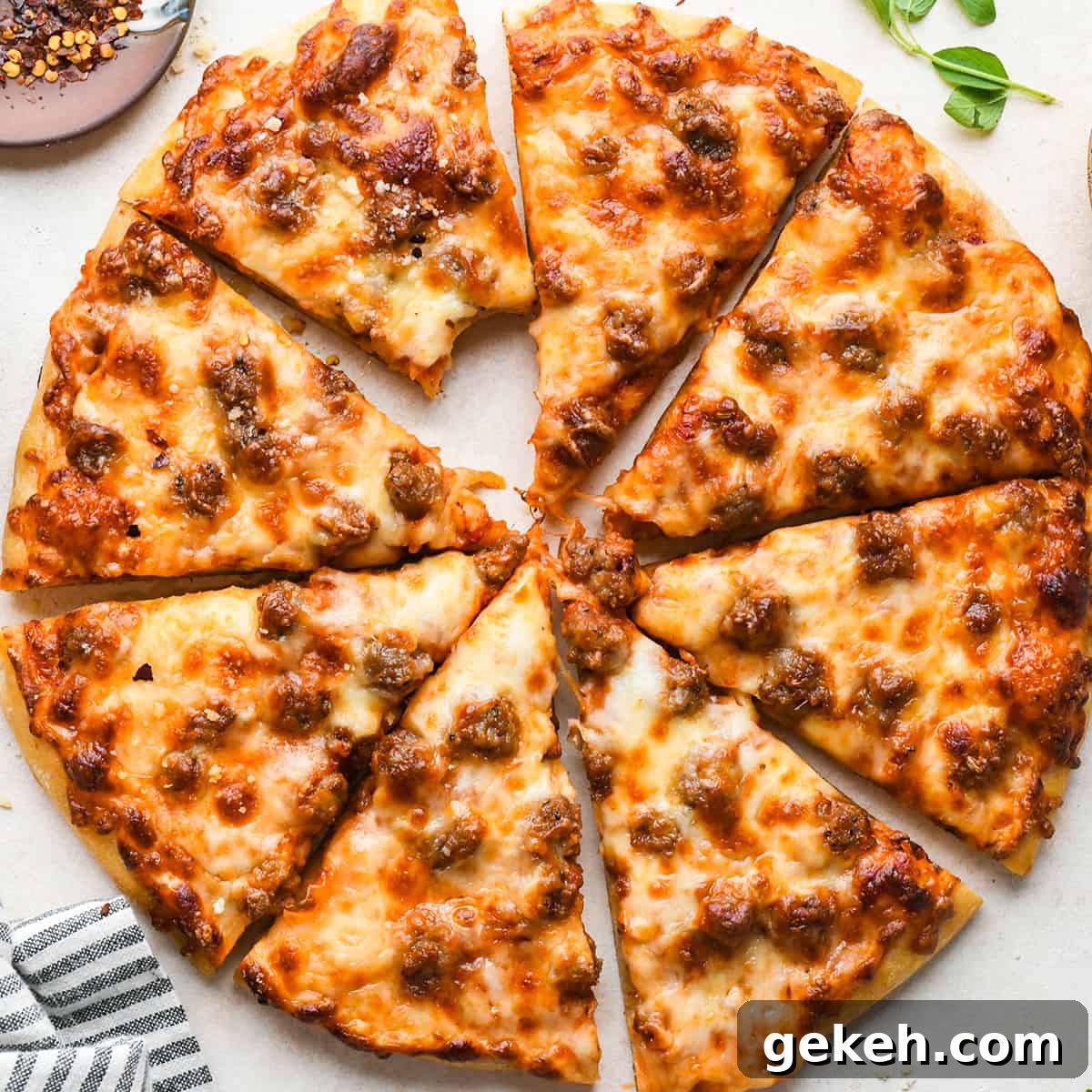 Classic Sausage Pizza Recipe: Crispy Crust & Savory Toppings 17 8 slices of Sausage Pizza, one with a bite taken out of it