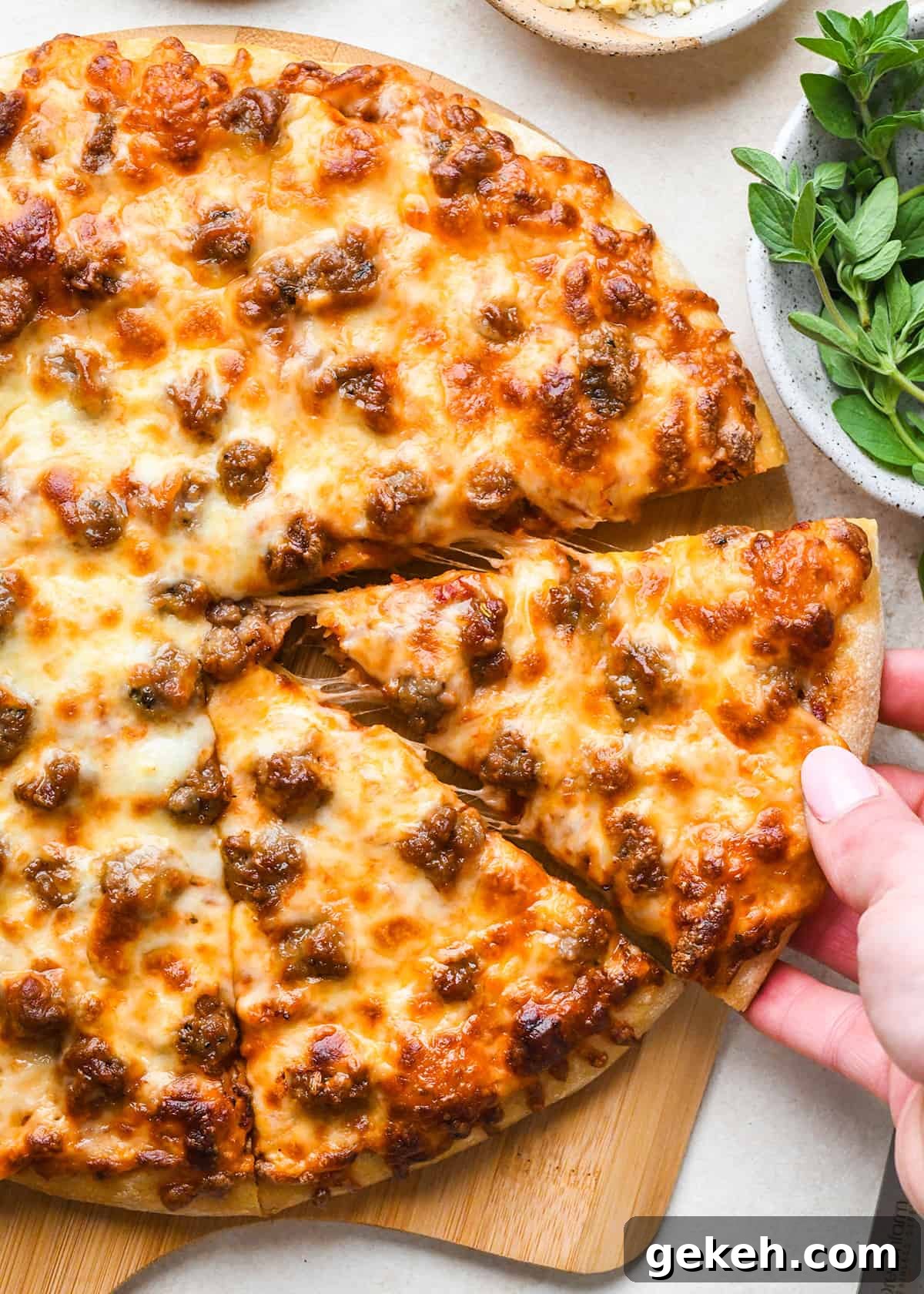 Classic Sausage Pizza Recipe: Crispy Crust & Savory Toppings 3 Sausage Pizza with 2 slices cut out