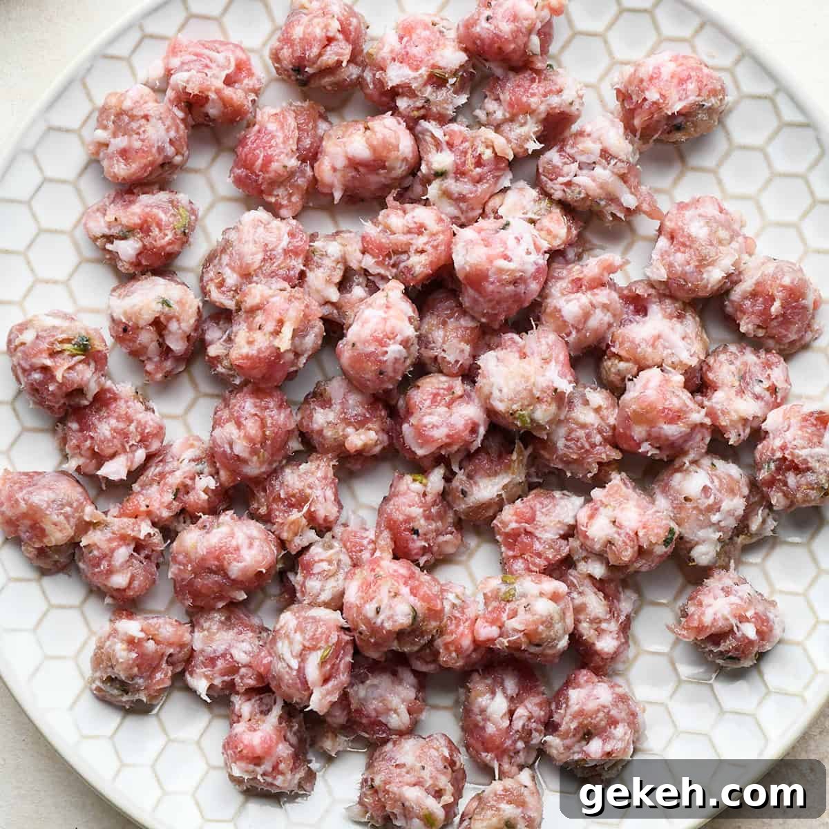 Classic Sausage Pizza Recipe: Crispy Crust & Savory Toppings 6 sausage on a plate before baking