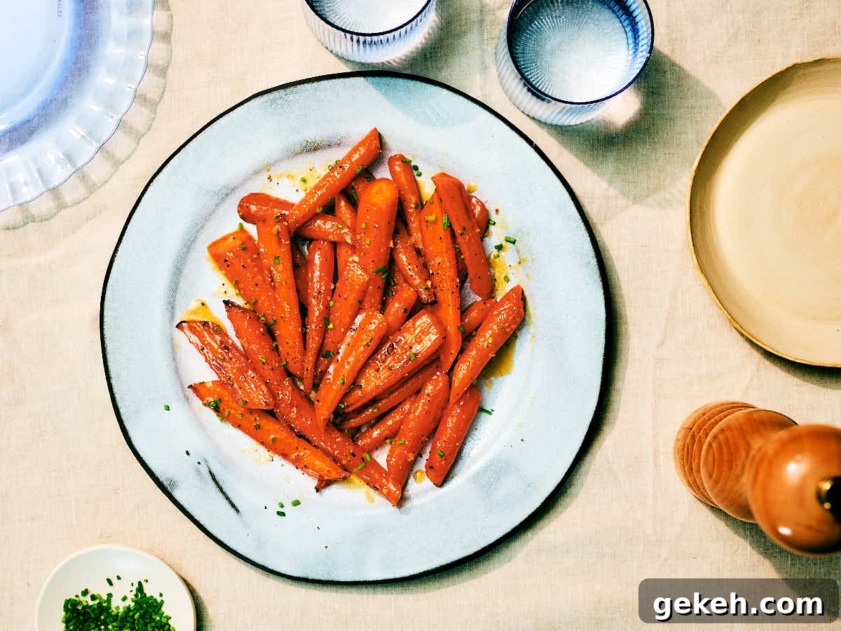 Air Fryer Honey Roasted Carrots on a serving plate at a dinner table.