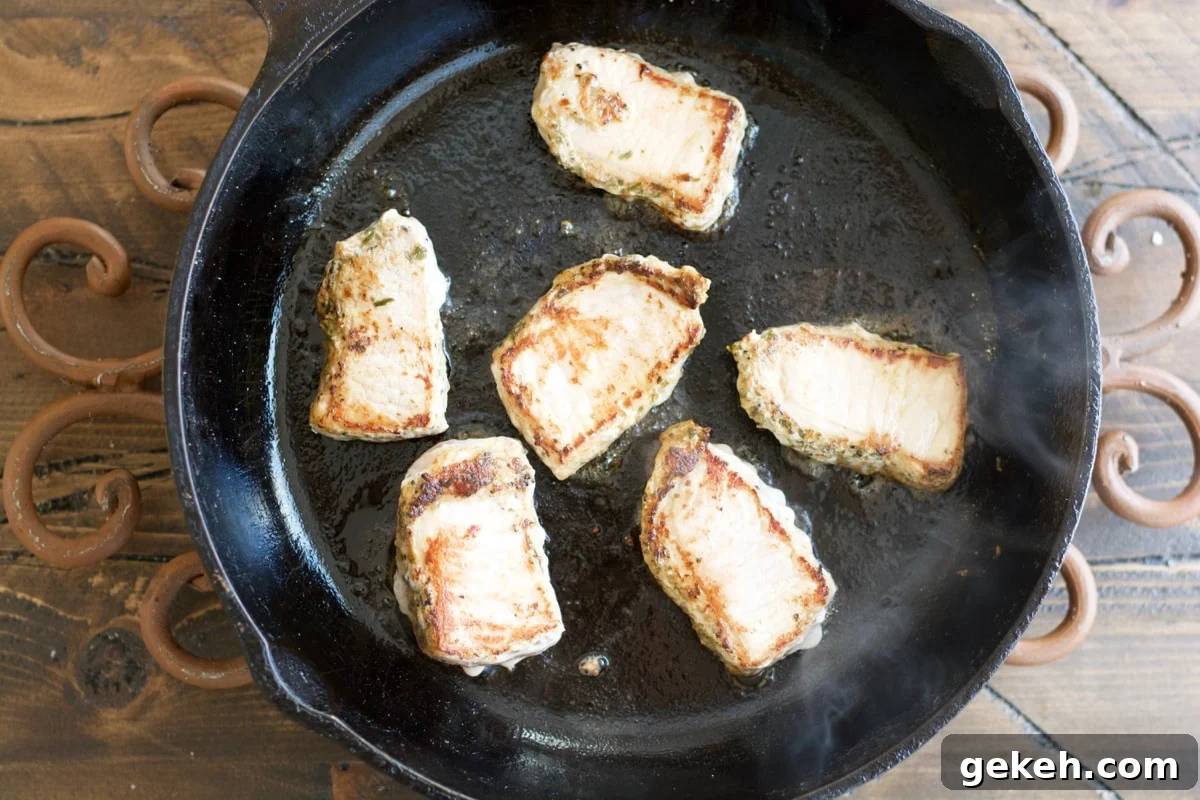 Garlic-Herb Pork Medallions with Tuscan White Beans Recipe 4 Make these easy one pan Garlic Herb Pork Medallions with Tuscan White Beans for a hearty comforting dish ready in under 30 minutes!