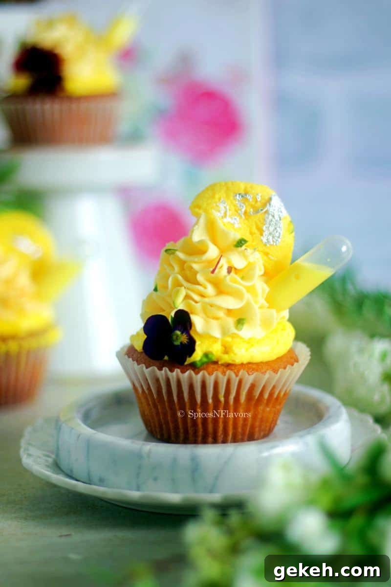 close up image of rasmalai cupcake placed on white marble coaster