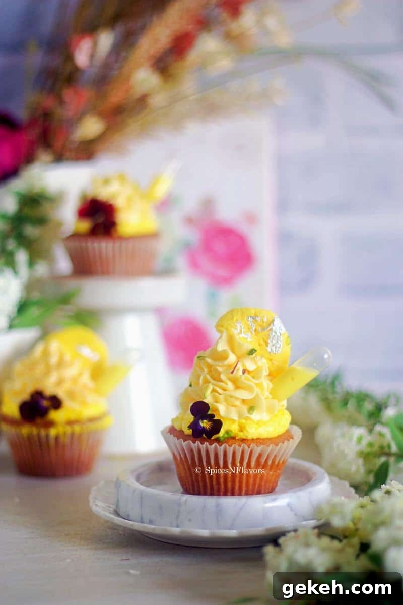 image of cupcake placed on marble coaster with few more cupcakes in the background
