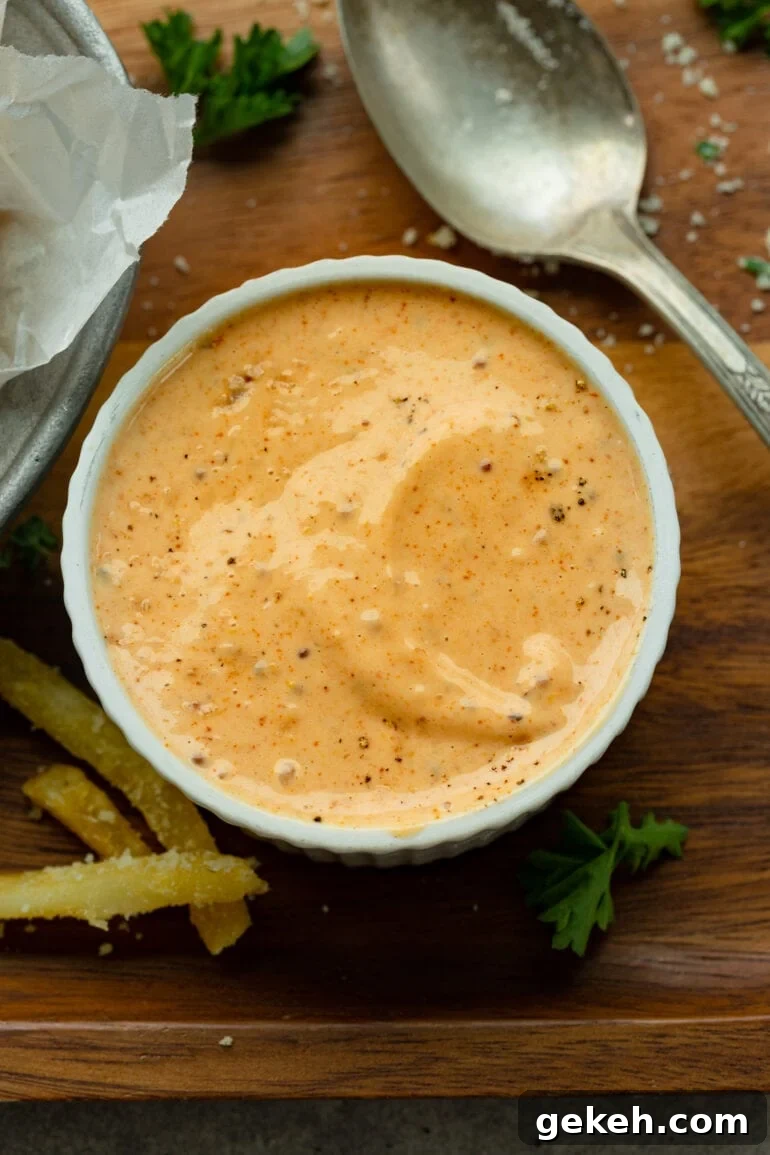 How to Make Disneyland-Style Pomme Frites at Home 5 a photo of a ramekin full of a cajun dipping sauce for french fries.