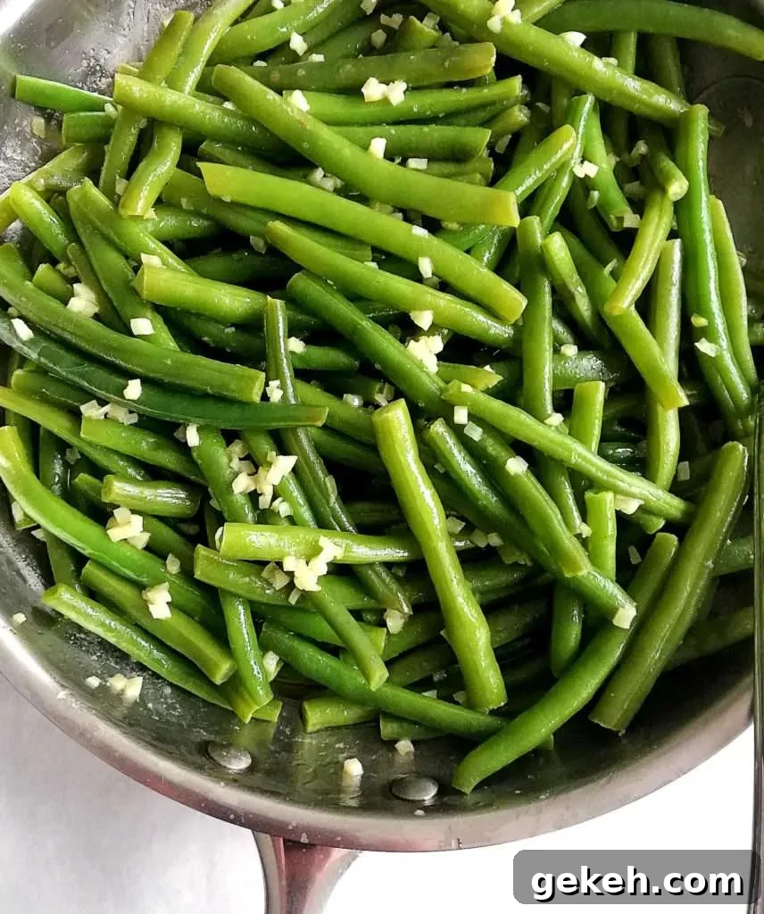 7 Classic Thanksgiving Sides to Make This Year 5 garlic green beans in skillet close up