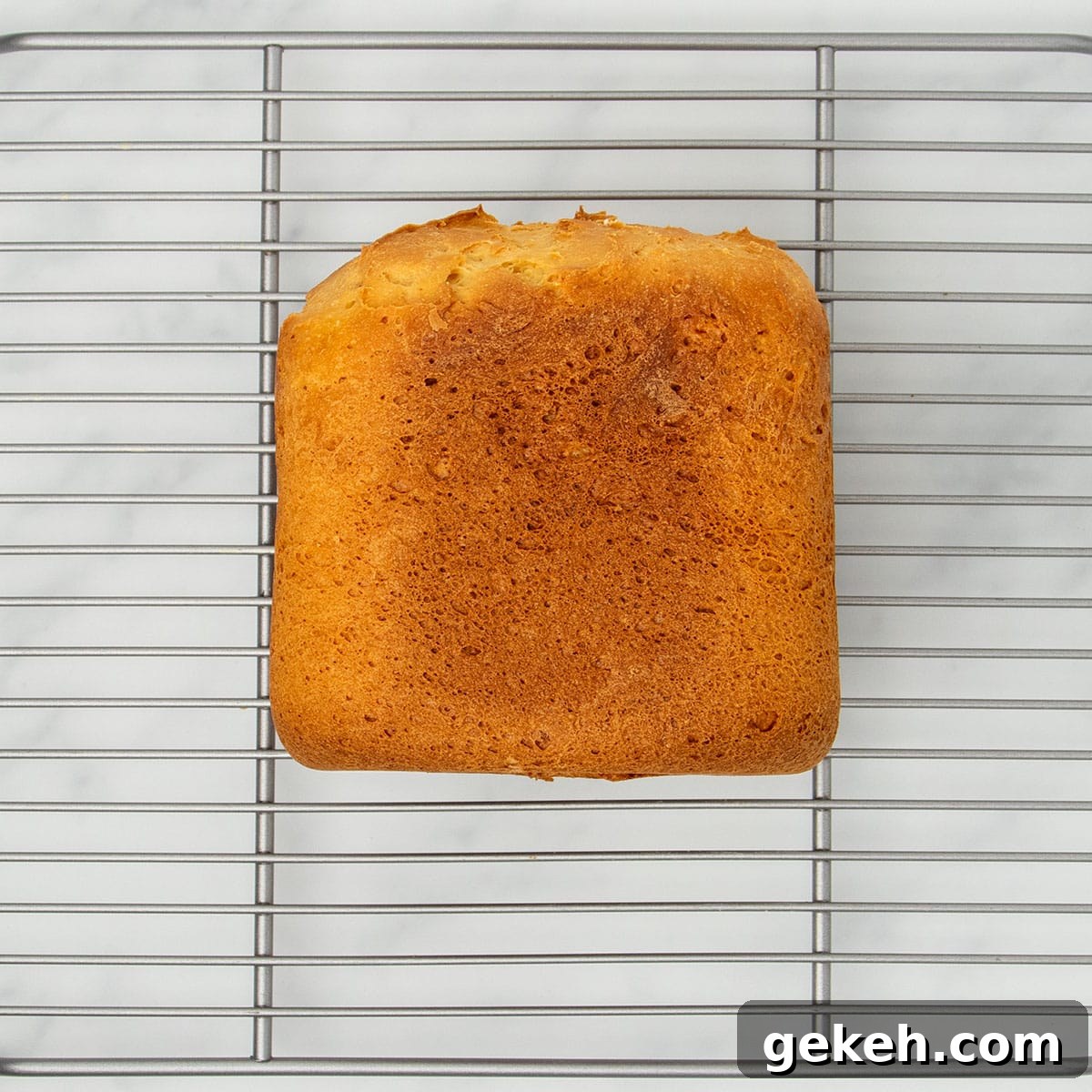 image of side of bread machine bread on same wire silver metal rack