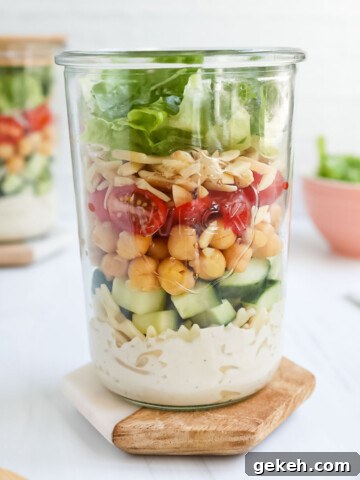 A layered salad in a mason jar.