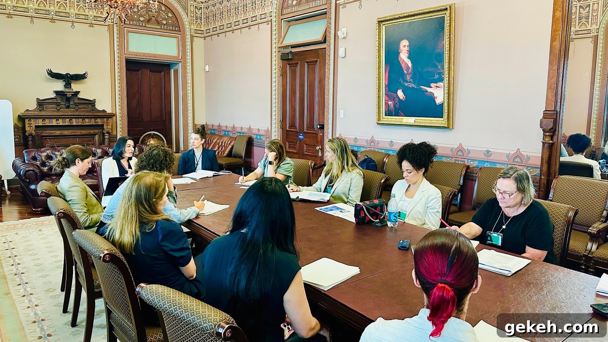 5 Key Lessons from My Advocacy Days in Washington, D.C. 6 Lisa Bronner and other various staff members sitting about a long table deep in discussion and taking notes in an ornately decorated room.