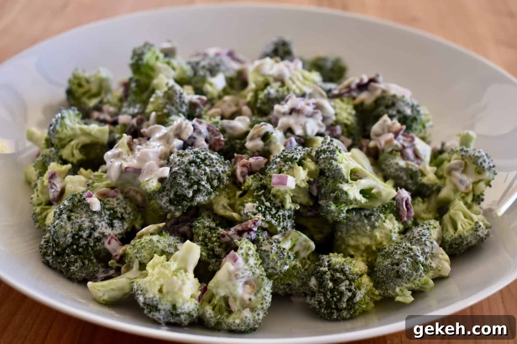 Broccoli and Cranberry Salad with Creamy Greek Yogurt Dressing 2 Broccoli Cranberry Salad in a white bowl.