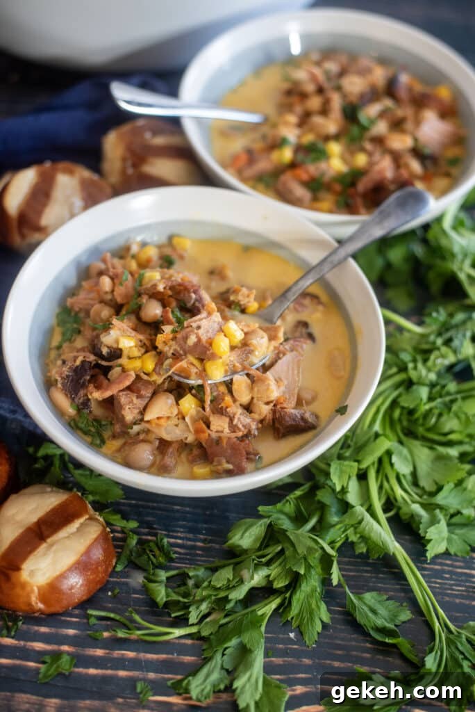 Hearty ham white bean soup with ham hocks and a ham bone. Easy ham and bean soup recipe using canned beans turns out creamy, smoky, and perfect comfort food every time.