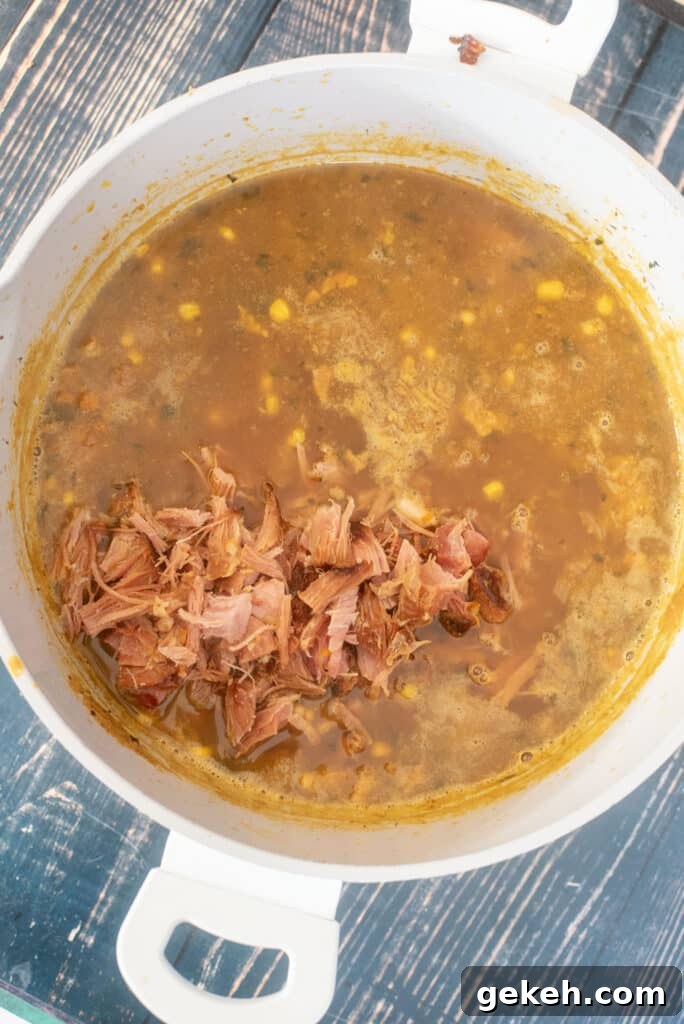 stirring ham into bean soup