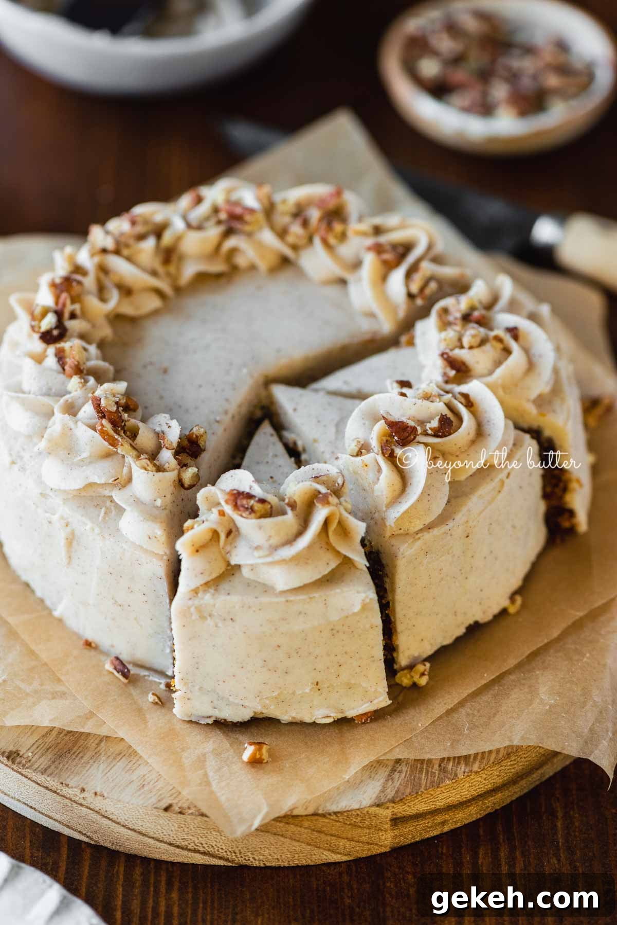Angled overhead image of sliced 6 inch single layer carrot cake on parchment paper | All Images © Beyond the Butter®