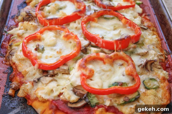Packed with brussels sprouts, mushrooms, cauliflower, spinach and topped with piles of fresh arugula, this Leek & Mushroom pizza is a veggie lover's dream!