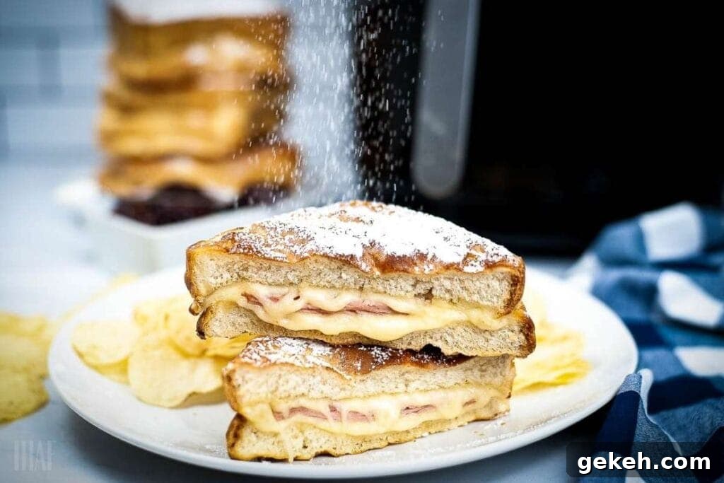Crispy Air Fryer Monte Cristo Sandwich Recipe 7 air fried monte cristo sandwich being dusted with powdered sugar