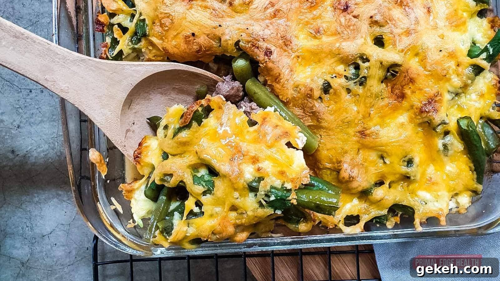 15 Sophisticated Dinner Ideas to Impress with Minimal Effort 13 Green bean casserole being served with wooden spoon.