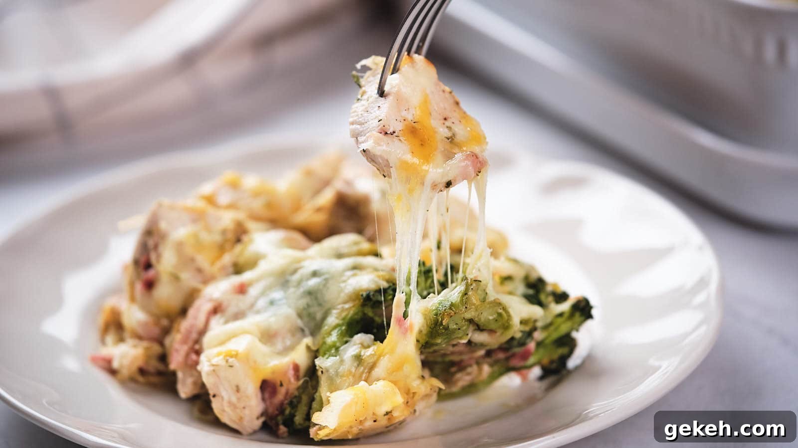 15 Sophisticated Dinner Ideas to Impress with Minimal Effort 4 A creamy broccoli casserole being served from a baking dish.