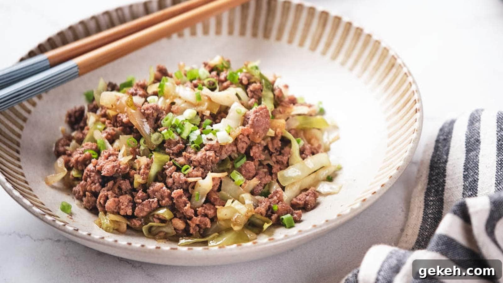 15 Sophisticated Dinner Ideas to Impress with Minimal Effort 8 Ground beef and cabbage stir fry being scooped out from a skillet.