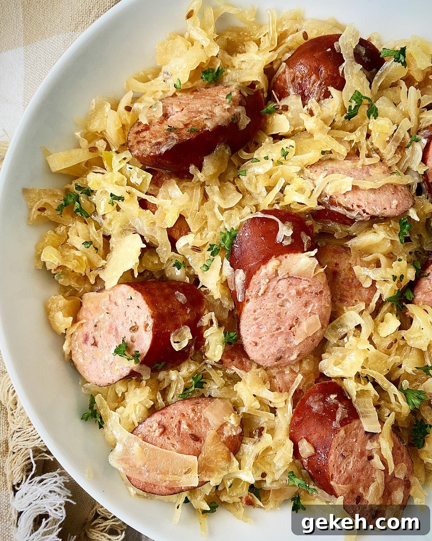 Slow Cooker Sausage with Sauerkraut: Simple Comfort Meal 6 overhead shot of Sausage & Sauerkraut in a white bowl