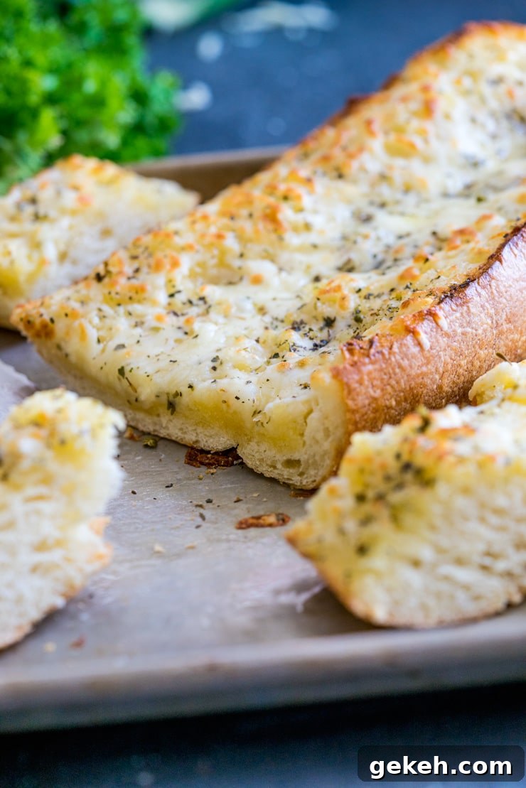 Cheesy Garlic Bread Recipe: Crispy, Gooey, and Irresistible 2 The Best Cheesy Garlic Bread! You might shirk at one of the ingredients, but believe me, you're going to want to try this one! Buttery, tangy, garlicky, and so, so cheesy. THE BEST!
