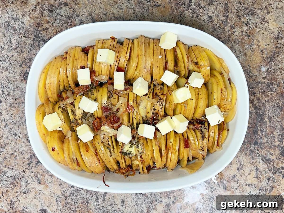 Creamy Scalloped Potatoes with Crispy Bacon 20 Topping the scalloped potatoes with cubed butter.