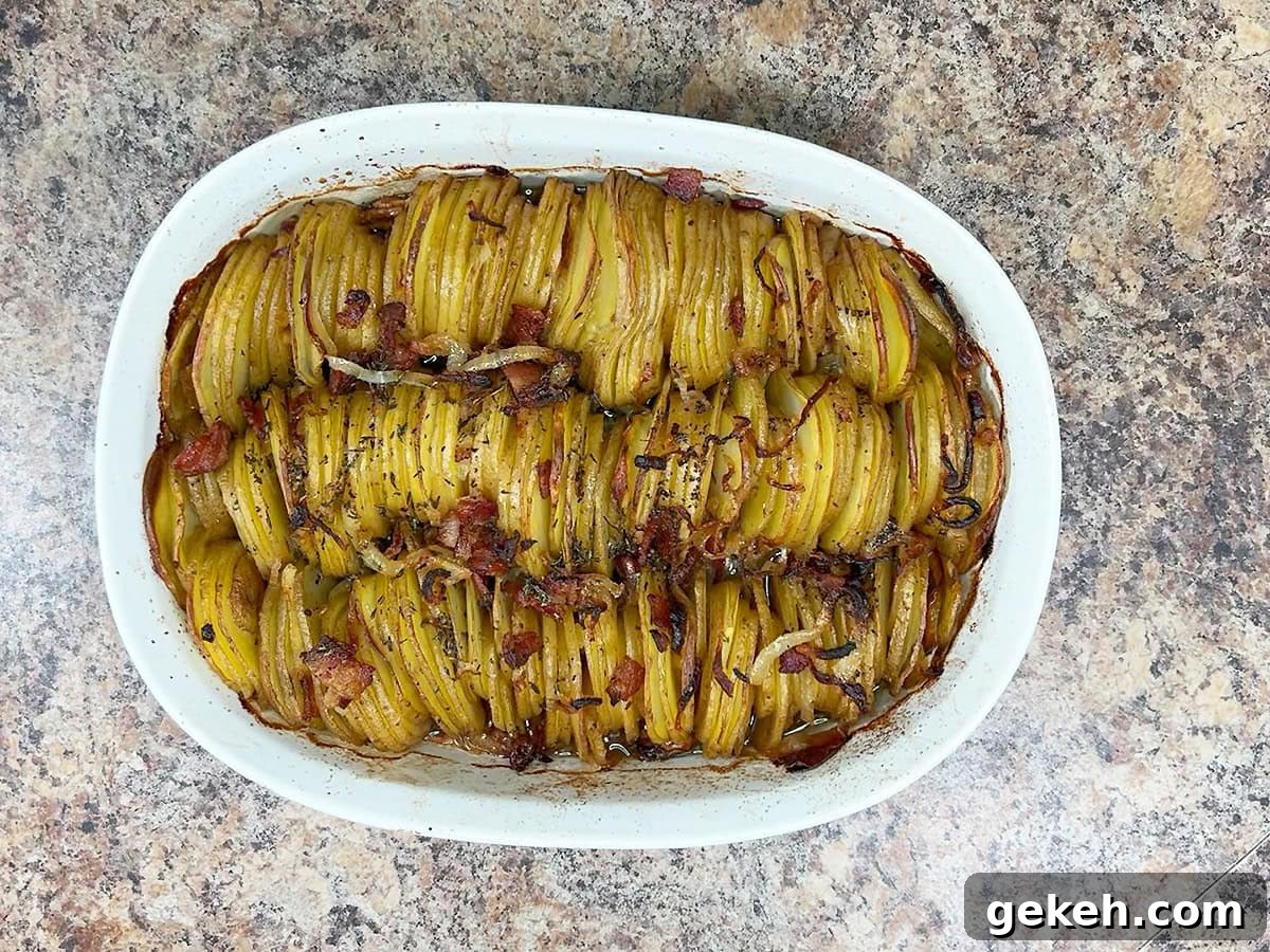Creamy Scalloped Potatoes with Crispy Bacon 21 Scalloped potatoes with bacon after they have baked in the oven for 45 minutes.