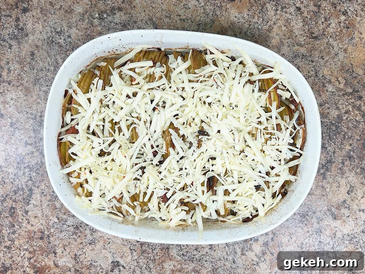 Creamy Scalloped Potatoes with Crispy Bacon 22 Scalloped potatoes with shredded pepper jack cheese spread over the top.