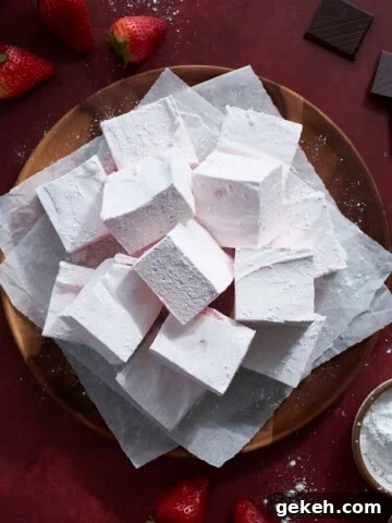 Strawberry Pink Marshmallows on a wooden tray.