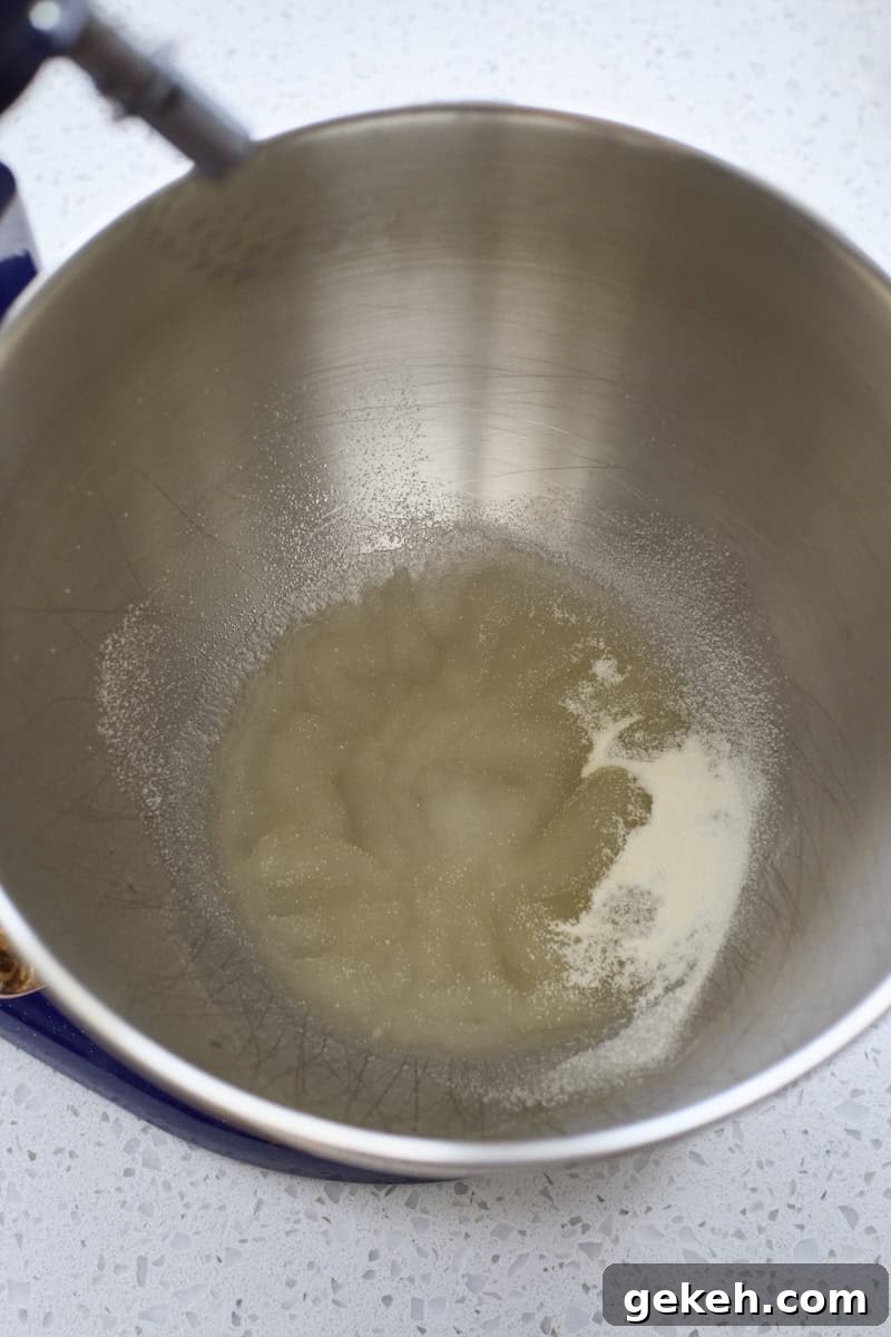 Gelatin blooming in the bowl of a stand mixer.