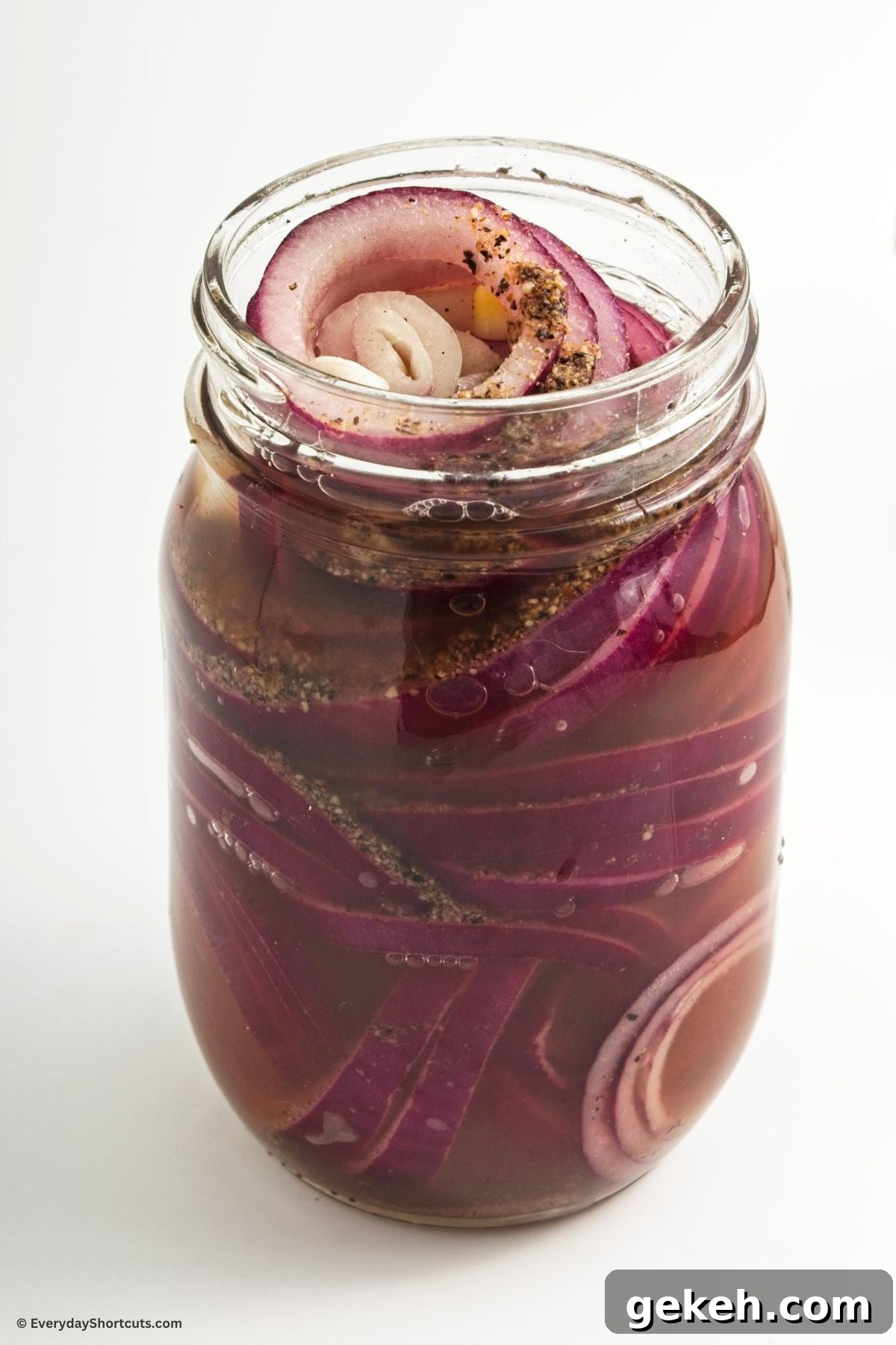 Crisp Quick-Pickled Red Onions for Toppings and Salads 7 pickling mixture in a jar with onions