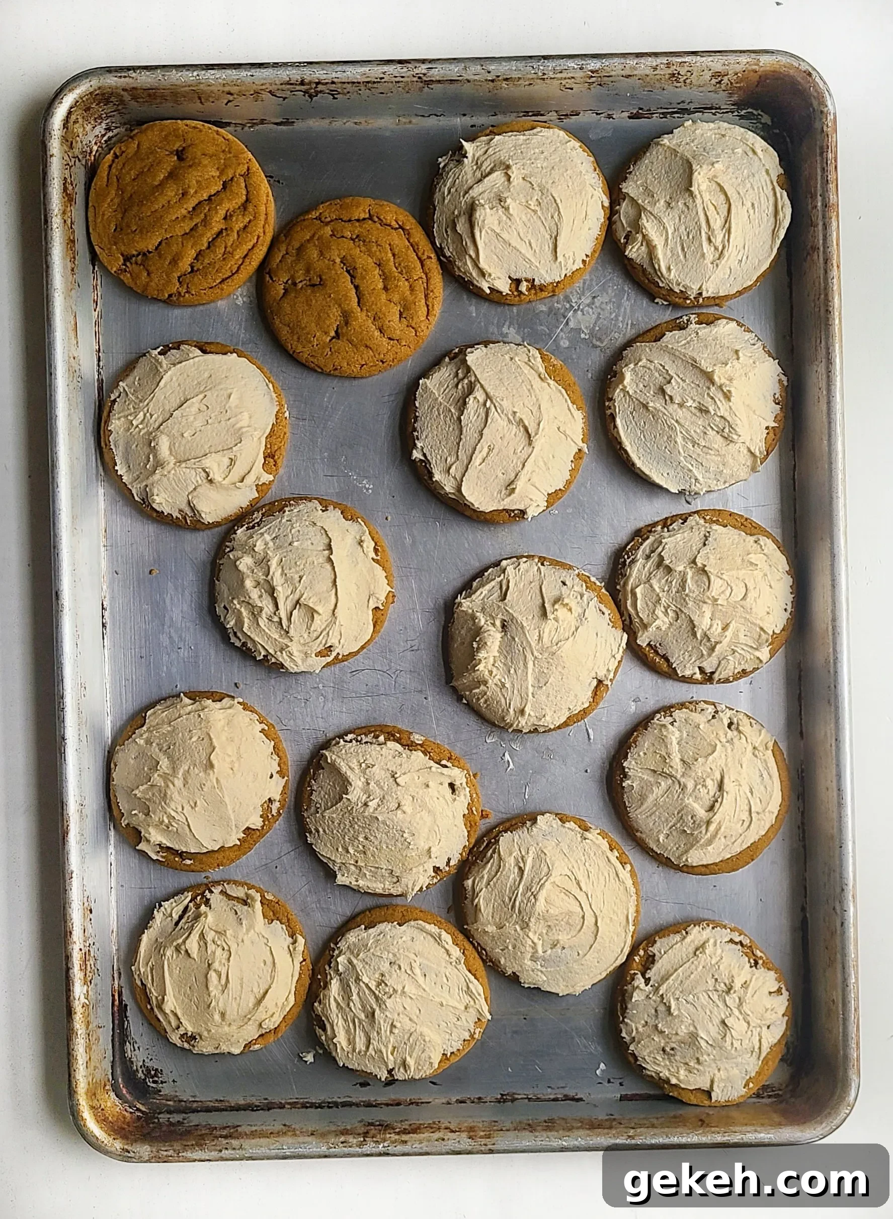 adding the buttercream to the pumpkin spice latte cookies