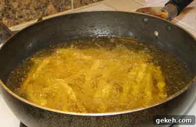 Serve Leftover Meat the Greek Way: Flavorful Ideas and Tips 2 Frying potatoes to serve with leftovers.