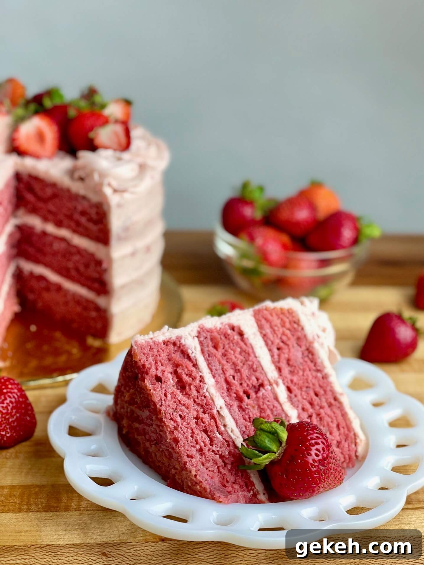 Bakery-Style Strawberry Buttercream Frosting Recipe 2 Fresh Strawberry Cake with fresh strawberry frosting and fresh berries on top.